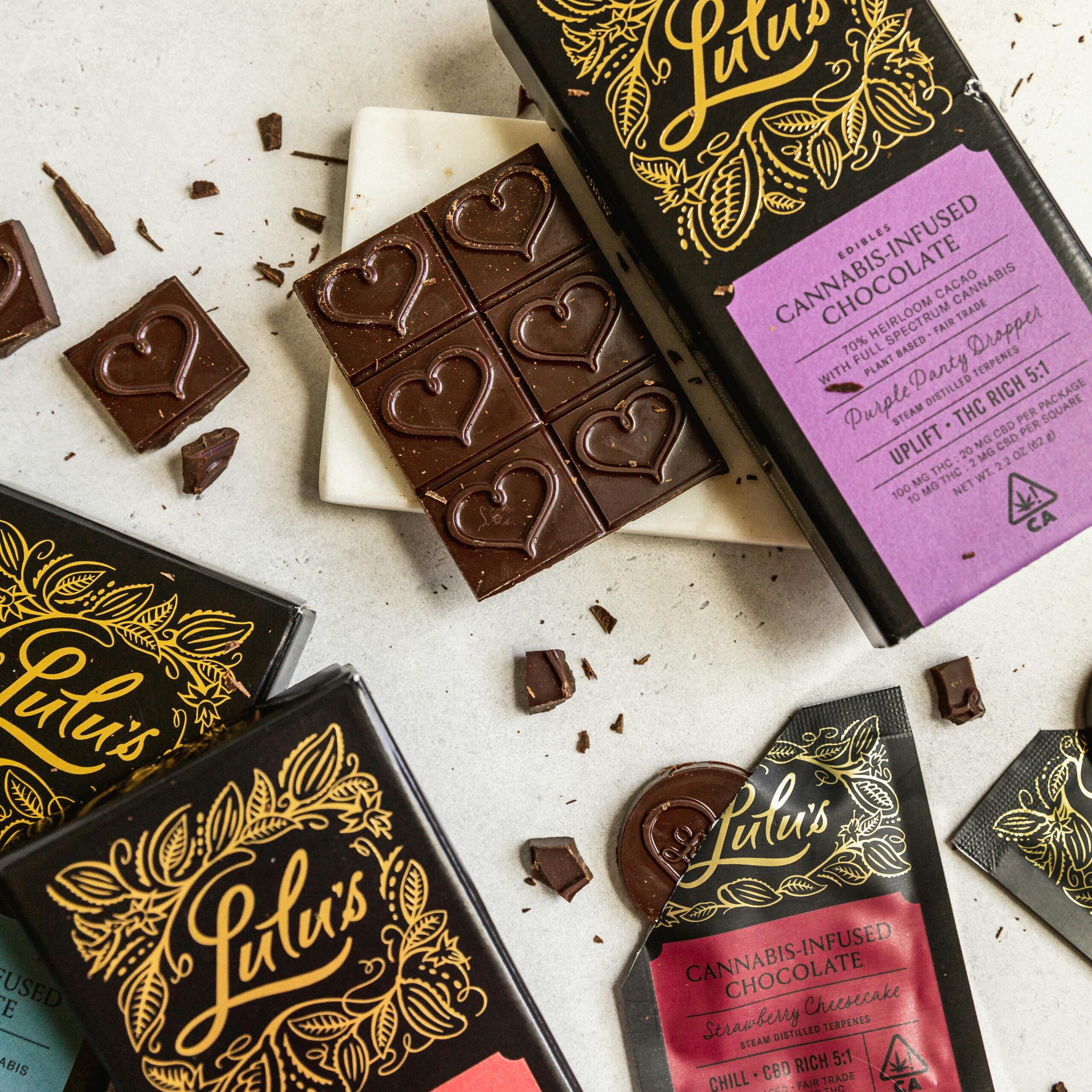 Close-up of cannabis-infused chocolate bars with a heart design from Lulu's. Perfect for gourmet adventures.
