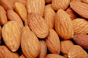 High-resolution close-up of raw organic almonds showcasing texture and natural color.